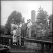 Group standing by stones in cemetery (ddr-densho-426-2472)