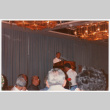 Man speaking at podium (ddr-densho-368-381)