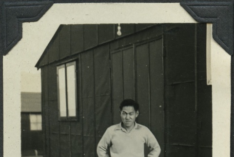 Man standing outside of barracks (ddr-manz-4-232)