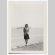 Woman stands on a shore (ddr-densho-404-417)
