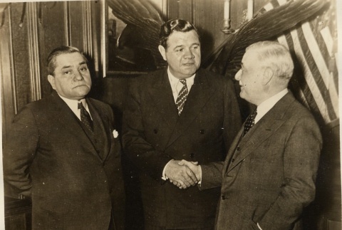 Babe Ruth shaking hands with a man (ddr-njpa-1-1391)