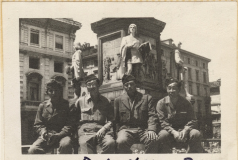 Four men sitting in front of statues (ddr-densho-466-397)