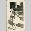 Little girl sitting on steps (ddr-densho-321-267)