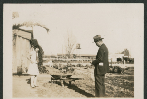man and woman in garden (ddr-densho-378-564)