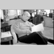 Ray Aka reading (ddr-densho-1007-1177)