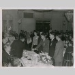 Men shaking hands at J.A.C.L. formal dinner (ddr-densho-201-457)