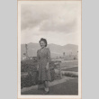 Woman standing outside (ddr-manz-10-22)