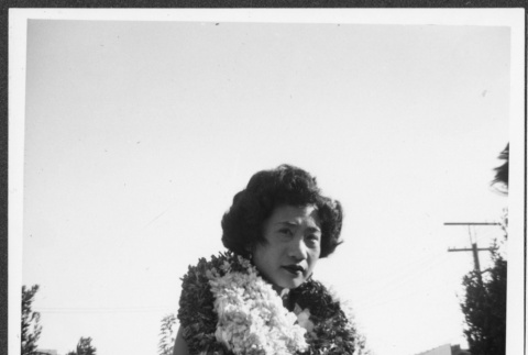 Nisei woman wearing leis (ddr-densho-363-288)