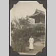 A women standing in front of a building (ddr-densho-432-178)