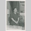 Woman standing on porch (ddr-densho-326-43)
