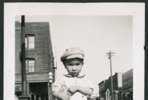 Photo of a child holding a bag (ddr-densho-483-720)