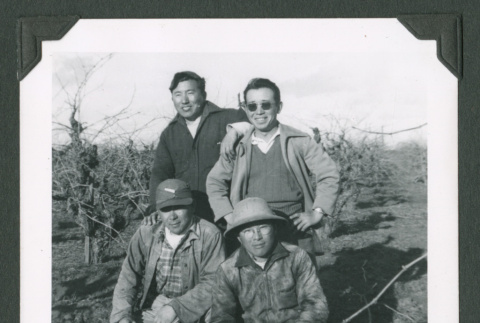 Four men in a field (ddr-densho-471-193)