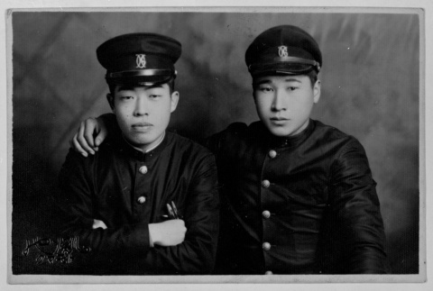 Two servicepeople with arms around each other (ddr-densho-1007-48)