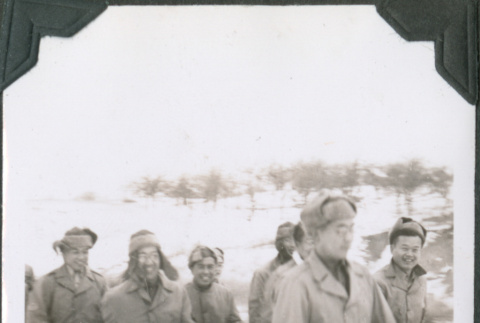 Group of smiling men walking in snow (ddr-ajah-2-452)