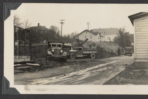 Trucks parked at the temple construction site (ddr-sbbt-4-71)