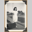 Young woman on a tennis court (ddr-densho-542-233)