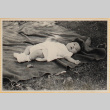 Susan Shiomi laying on blanket (ddr-densho-522-149)