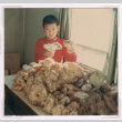 Mark Isoshima with table covered in matsuake mushrooms (ddr-densho-477-498)