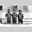 Three men standing outside building (ddr-ajah-2-754)