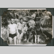 Four men standing in river in swim trunks (ddr-ajah-2-637)