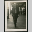 Man walking down sidewalk (ddr-densho-359-919)