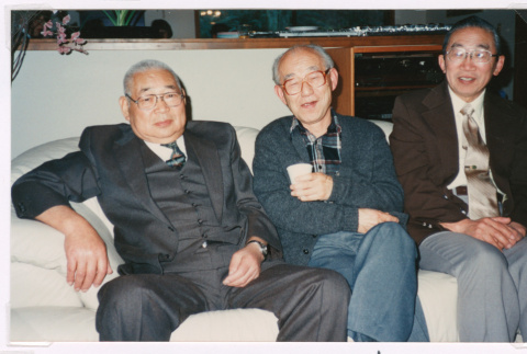 Three friends on couch (ddr-densho-477-641)