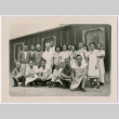 Japanese American men and women wear aprons/ uniforms (ddr-densho-362-6)