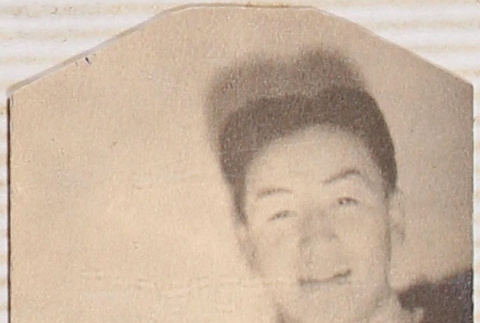 Man leaning on pillow (ddr-densho-464-91)