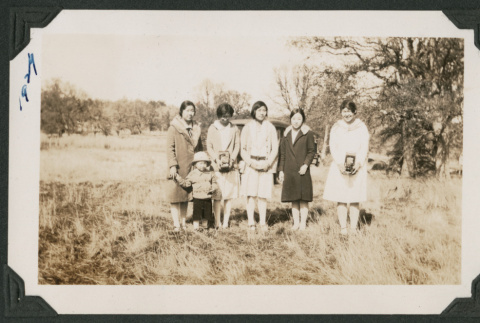 five women and a child posed in a field (ddr-densho-378-566)