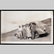 Three men and two women lean against a car (ddr-densho-404-45)