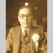 Man with a ribbon pinned to his chest (ddr-njpa-4-2439)