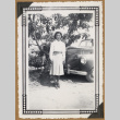 Mits poses beside a car (ddr-densho-542-55)