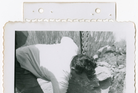 Attaching rock to crane (ddr-densho-377-1782)