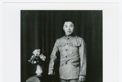 Man with vase of flowers (ddr-densho-1007-355)