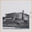 Shiomi family standing in front of house (ddr-densho-522-509)