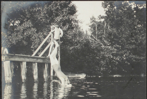 Men swimming from dock (ddr-densho-355-725)