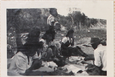 Group sitting on ground at picnic (ddr-densho-464-71)
