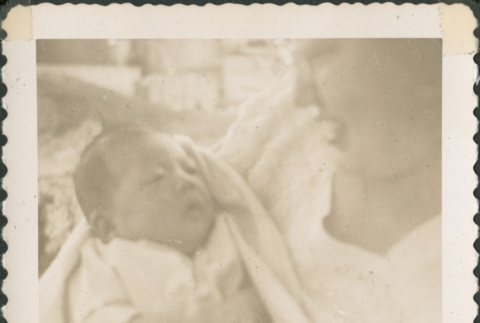 Woman holding a baby (ddr-densho-321-265)