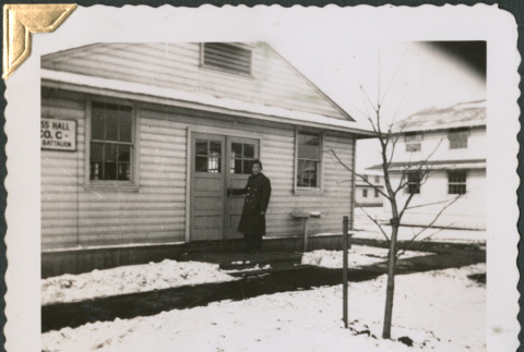 Man in uniform standing outside Mess Hall (ddr-densho-434-29)