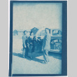 Two men and a woman standing by taxi (ddr-densho-329-1359)