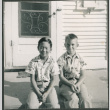 Two boys sitting in steps (ddr-densho-523-292)