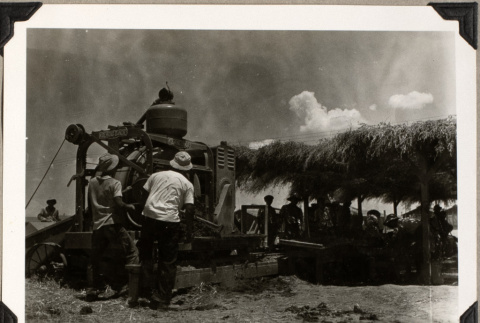 Group working with farm machinery (ddr-densho-587-88)