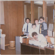 Five  people behind a desk (ddr-densho-426-1199)