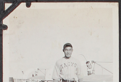 Photo of young man in baseball uniform on ship (ddr-densho-326-93)