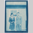Couple standing outside barracks (ddr-densho-329-1361)