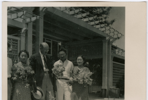 Four people outside hospital (ddr-densho-329-832)