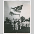Three service people with American flag (ddr-densho-1007-42)