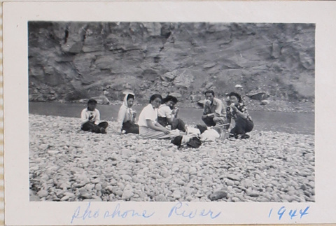 Group picnicking by river (ddr-densho-464-30)