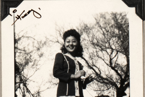 Woman standing by tree (ddr-densho-587-52)