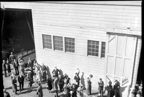 Group of people waving on dock (ddr-densho-426-278)